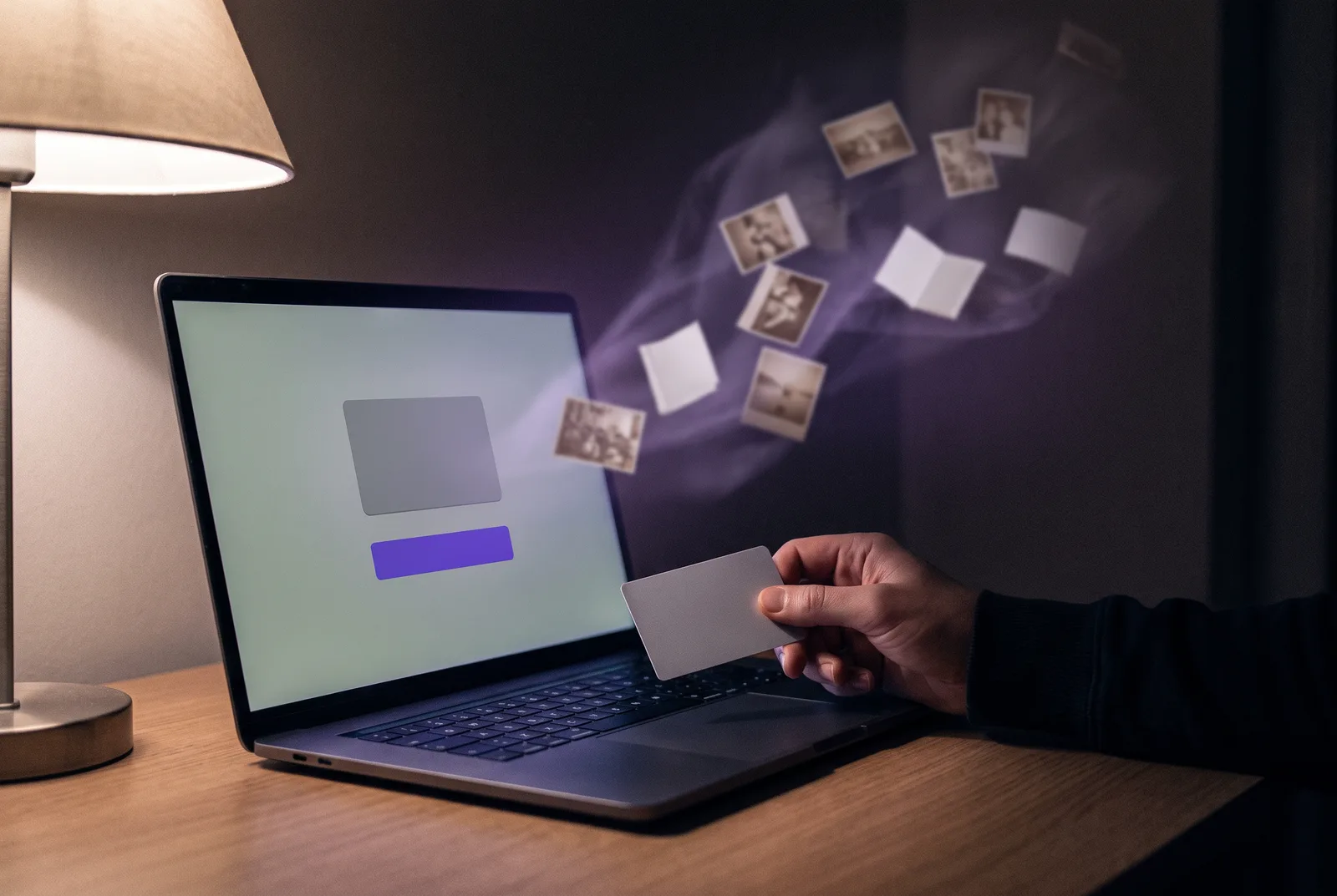 A laptop at night showing a plain checkout panel with a violet button. A hand holds a blank card toward it, while a faint stream of translucent photos and documents drifts out of the back of the screen into the dark.