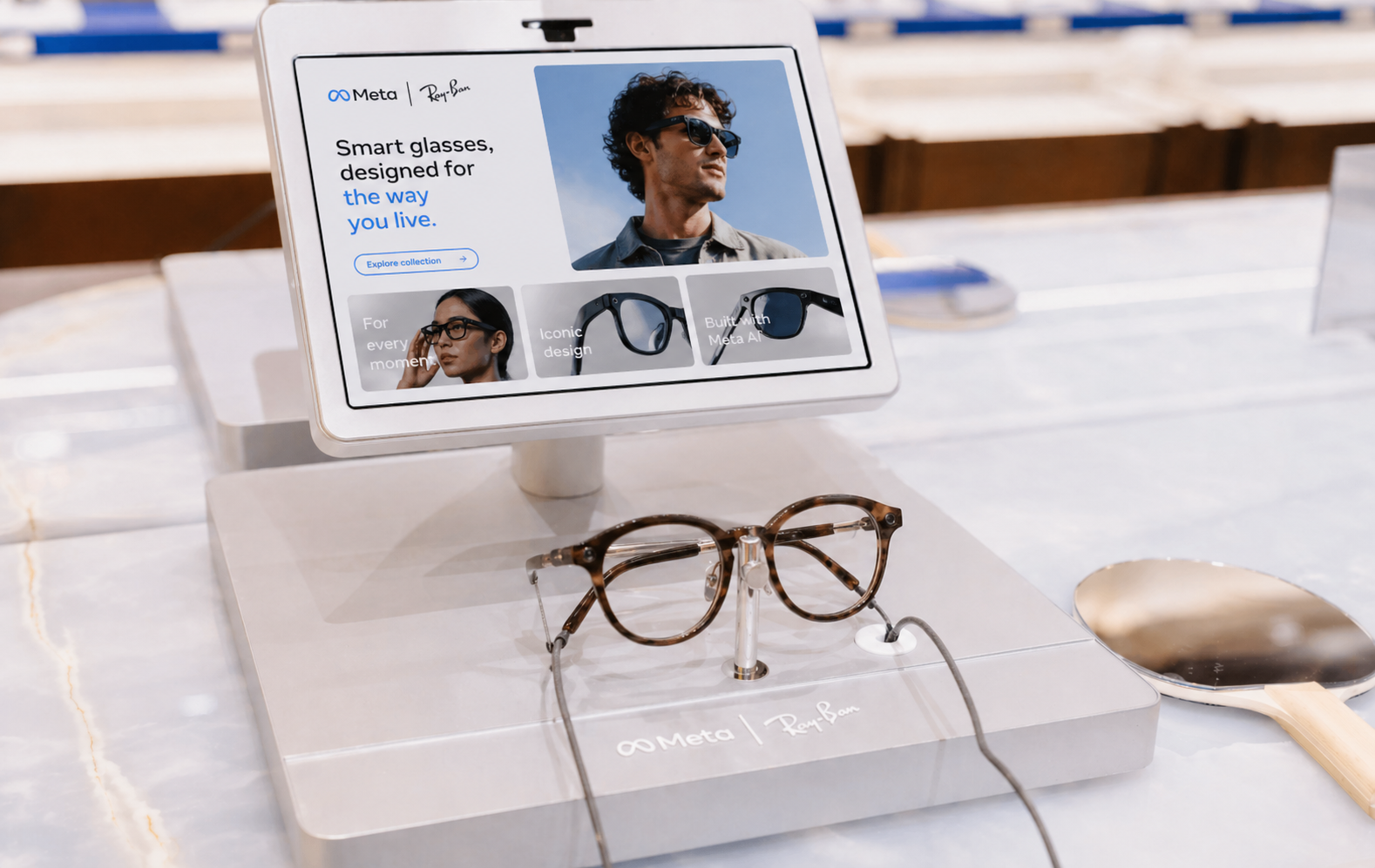 Meta Ray-Ban smart glasses on display in a retail store, with marketing screen reading 'Smart glasses, designed for the way you live.'